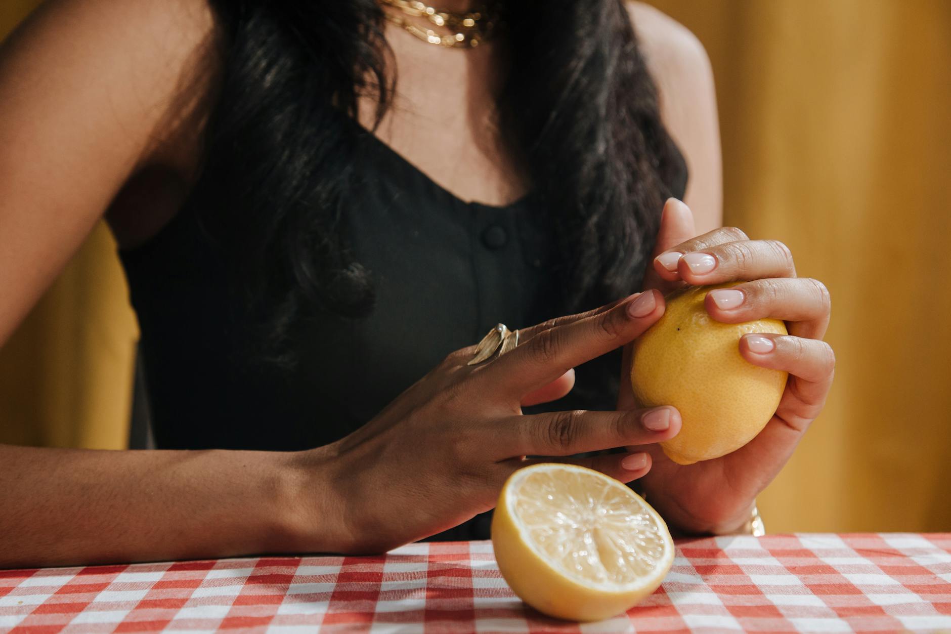 Woman holding a sleek vibrator, contemplating intimacy and pleasure during postpartum recovery
