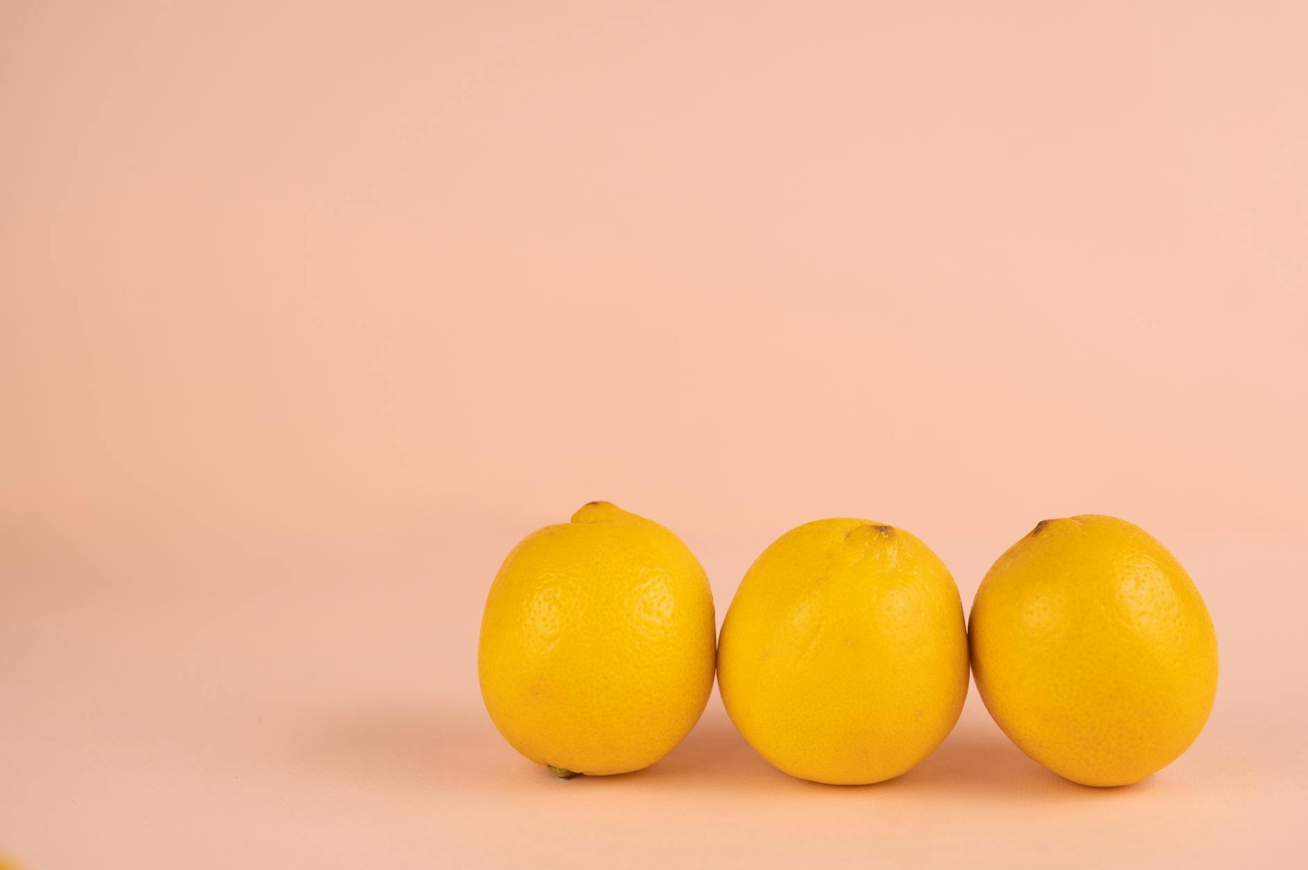 Bright fresh lemons arranged on a pastel background symbolizing renewal and recovery